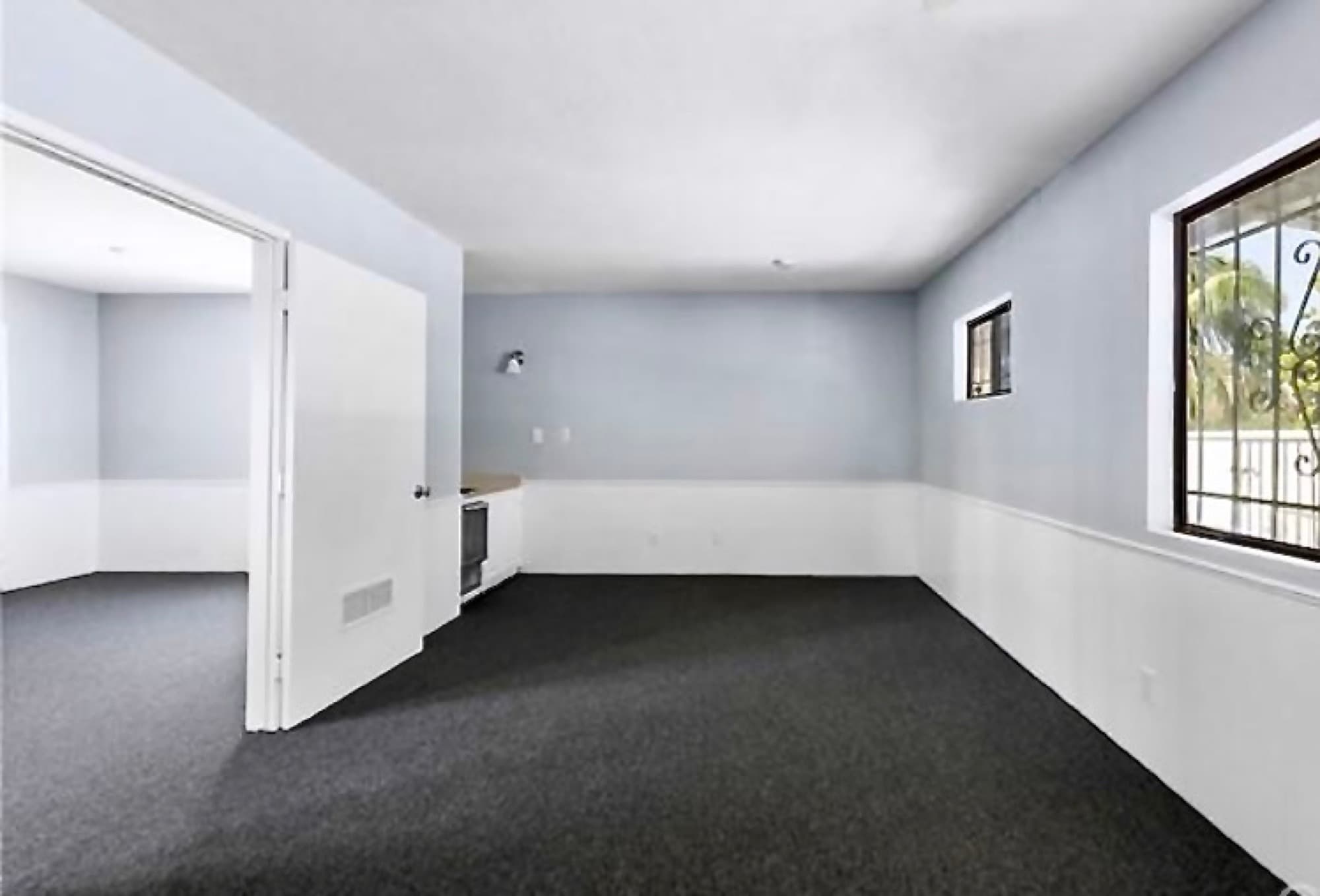 Pale-blue commercial office interior after repaint.