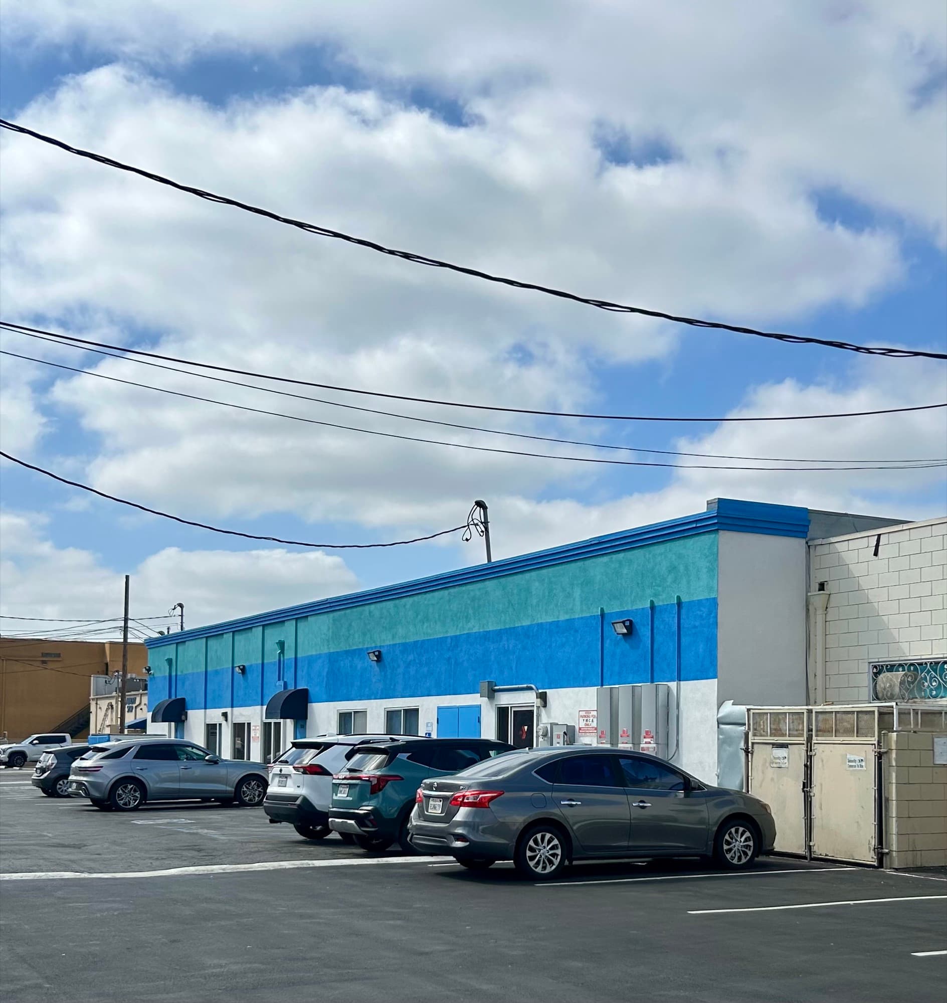 Blue commercial building exterior after repaint.