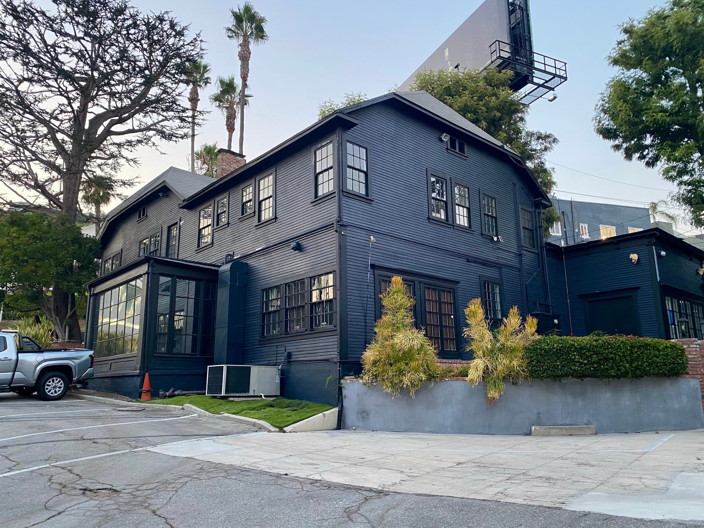 A large craftsman building repainted in deep navy by PZ Painting